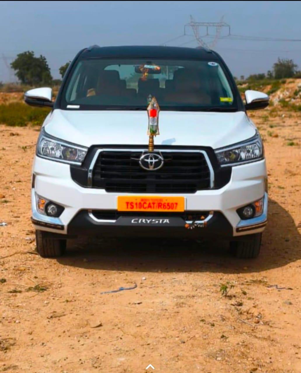 White Toyota Crysta front view for private trips