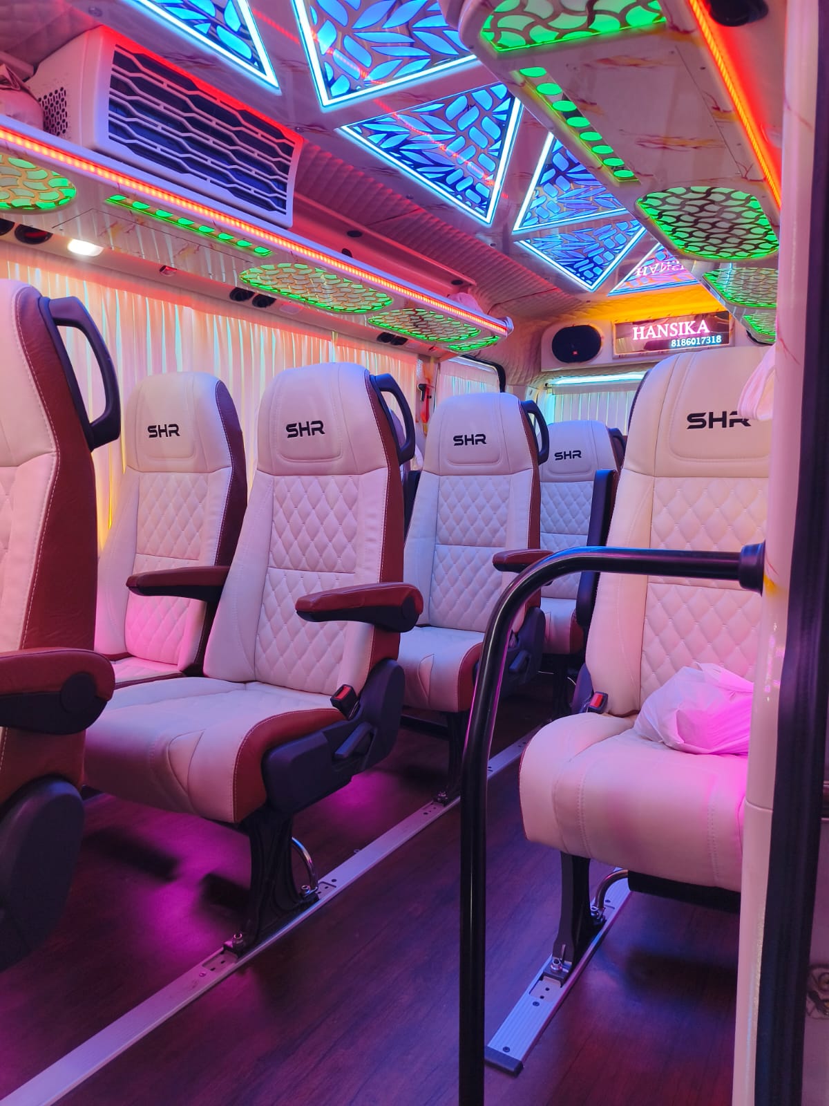 Luxury bus seating with colorful lighting